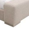 Close detail of footboard’s fabric texture and wooden block foot beneath rounded corner