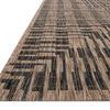 Close-up low angle of rug edge showing woven texture and flat binding