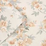 Rolled sheet of Rosamund wallpaper highlighting soft floral pattern and smooth paper texture