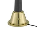 Lamp on/off switch in off state with attached power cord on brass base