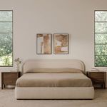 Front view of Colin bed with beige bedding, wooden nightstands and abstract artwork in bright room