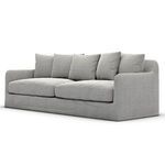 Angled view showing sofa depth and curved arm style with textured ash slipcover
