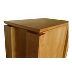 Close-up of the Brook nightstand’s floating undercut top edge and wood grain texture
