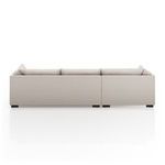 Rear view focusing on back panel upholstery and sturdy espresso-colored banak wooden base blocks