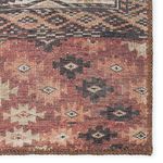 Close-up of different rug corner highlighting textured weave and stitched brown edging