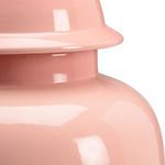 Close-up of the smooth glossy surface and rounded edge of the urn lid