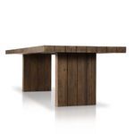 Low angle showing underside of tabletop and two solid rectangular legs