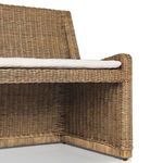 Front angled view highlighting fabric cushion with button tuft on Senna Woven Dining Bench