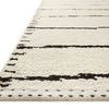 Close-up angled view showing stitched edge detail and texture of hand-woven fibers