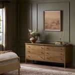 Front view showing clean drawer fronts with subtle wood grain and matched hardware placement