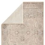 Corner fold-back showing the contrasting light cream underside weave of the rug