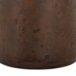 Detailed view of burl wood base with natural markings and rounded edges