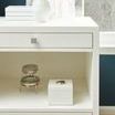 Close-up of Frances side table corner showing drawer details and white lacquered grasscloth texture near sunlit window
