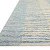 Edge view of Denim Rug displaying corner with border and low pile texture
