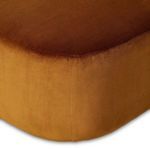 Close-up on seat edge and armrest with visible velvet texture and smooth stitching