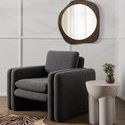 Sante End Table styled beside a gray cushioned armchair with decorative mirror above