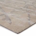 Close-up angled view highlighting the soft textured pile and abstract line details