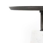 Horizontal view of Cronos end table displaying contrast between smooth marble and textured iron