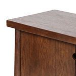 Detail of thick, polished oak tabletop corner with visible wood grain