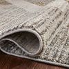 Close-up of rug edge rolled over highlighting the bound border and plush poly blend fibers