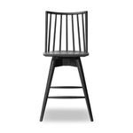 Front angled view of Lewis Swivel Stool highlighting tapered legs and curved seat edge