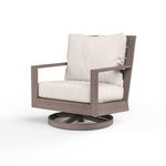 Outdoor swivel club rocker chair with hand-brushed driftwood finish aluminum frame and off-white cushions
