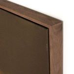 Close-up on walnut wood grain of floater frame and taut canvas edge in brown gradient