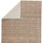 Top corner fold revealing light-colored rug backing and front lattice design