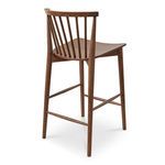 Rear three-quarter perspective emphasizing tapered walnut legs and backrest detail