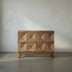Two-drawer Musashi Walnut console table with six faceted pyramidal drawer fronts, dark walnut wood, and minimal brass pulls.