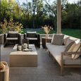 Sherwood sofa styled on covered patio surrounded by armchairs and natural light