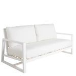 White aluminum loveseat with white cushions and modern geometric frame design for outdoor seating