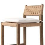 Close side angle focusing on the linen-blend seat cushion and cord weaving