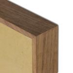 Tight focus on smooth rustic walnut frame edge with visible wood grain texture
