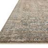 Angled side view showing the low profile and finely fringed edges of the Heritage Spa Earth Rug