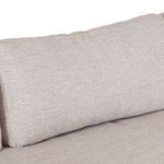 Close-up of smooth beige cushion fabric with visible weave detail