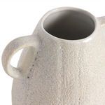 Top angled close-up of one handle and the smooth inner ceramic rim of the vase