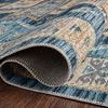 Rolled edge close-up displaying backing, stitching, and detailed print texture of Zion Ocean Gold Rug