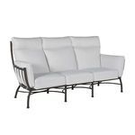 Side angle view of Majorca sofa with setting of white cushions and dark metal frame