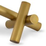 Close-up showing the intersection and seamless joints of the golden metal cylinders