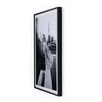 Angled side view emphasizing the depth and solid black finish of the photo frame