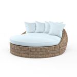 Havana Round Daybed with all-weather wicker frame in aged tobacco and light blue plush cushions and pillows