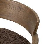 Close-up on smooth curved top of Bennett Chair’s oak backrest