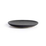 Side view of single matte black ceramic salad plate showing flat rim and thin profile