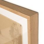 Close-up of oak frame corner with visible wood grain and frayed edge of canvas