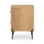 Side profile of nightstand showing natural wood grain and black metal legs from left side