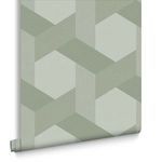 Close-up of Fractal Sage wallpaper roll showing geometric hexagon pattern and textured finish.