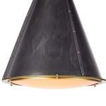 Angle showing textured blackened metal surface with brass studs on chandelier shade