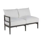 Three quarter front view of outdoor sectional sofa with left arm showing metal frame supports
