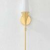 Luisa Wall Sconce with matte opal fluted shade and slender L-shaped aged brass arm on white wall